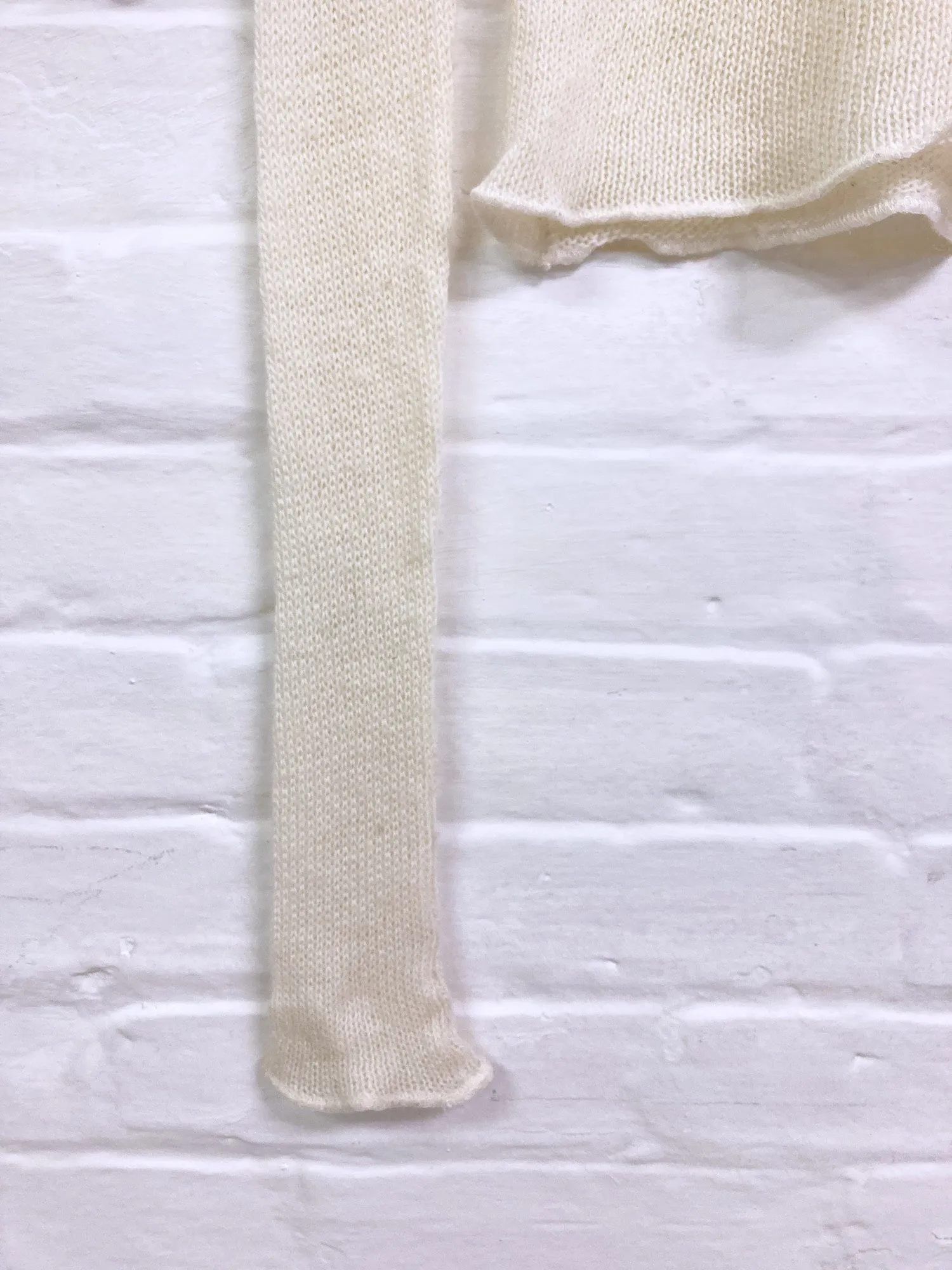Jean Colonna cream loose knit turtleneck with extra long sleeves